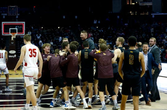 The Logan-Rogersville Wildcats celebrate after a buzzer beater to beat the Nixa Eagles in a semifinal Gold Division game during the Blue and Gold Tournament at JQH Arena on Saturday, Dec. 28, 2019.