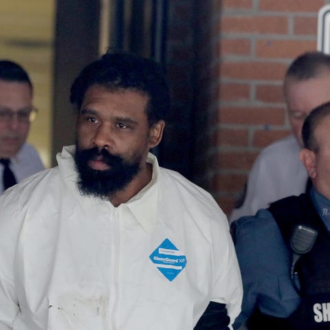 Grafton Thomas, 37, of Greenwood Lake, N.Y. is led