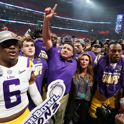 LSU coach Ed Orgeron celebrates with his players a