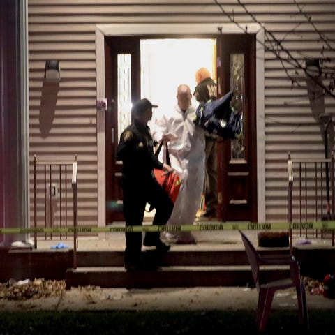Police work at a residence in Monsey, N.Y., early 