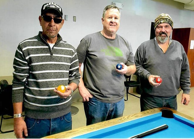 The December 2019 eight-ball billiard’s tournament winners, from left: 1st place Carlos Hernandez, 2nd place Steve Richards and 3rd place Kelly Smith