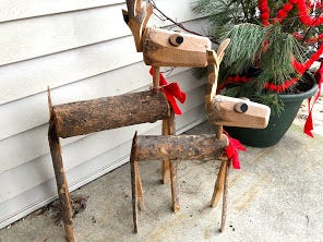 A pair or wooden, homemade deer crafted by Jerry Apps' son and family greet visitors at the front door of the Apps' household.