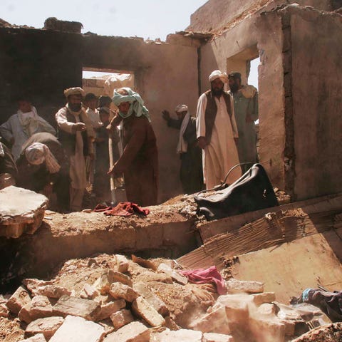 Villagers picked through the rubble for days after