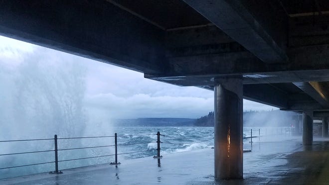 Waves crash against the Hood Canal bridge during high winds on Tuesday.