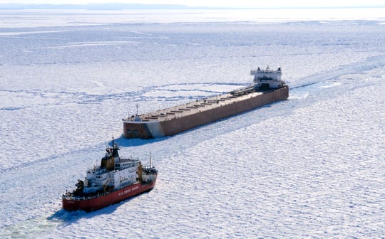 FILE - The US Coast Guard cutter Mackinaw works in thick ice to break out a freighter in Whitefish Bay of Lake Superior on March 27 2015