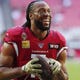 Wide receiver Larry Fitzgerald is nearing the end of his 16th NFL season, all with the Cardinals.
Michael Chow/USA TODAY NETWORK
Arizona Cardinals wide receiver Larry Fitzgerald (11) jokes with fans before playing against the Los Angeles Rams at State Farm Stadium December 1, 2019.