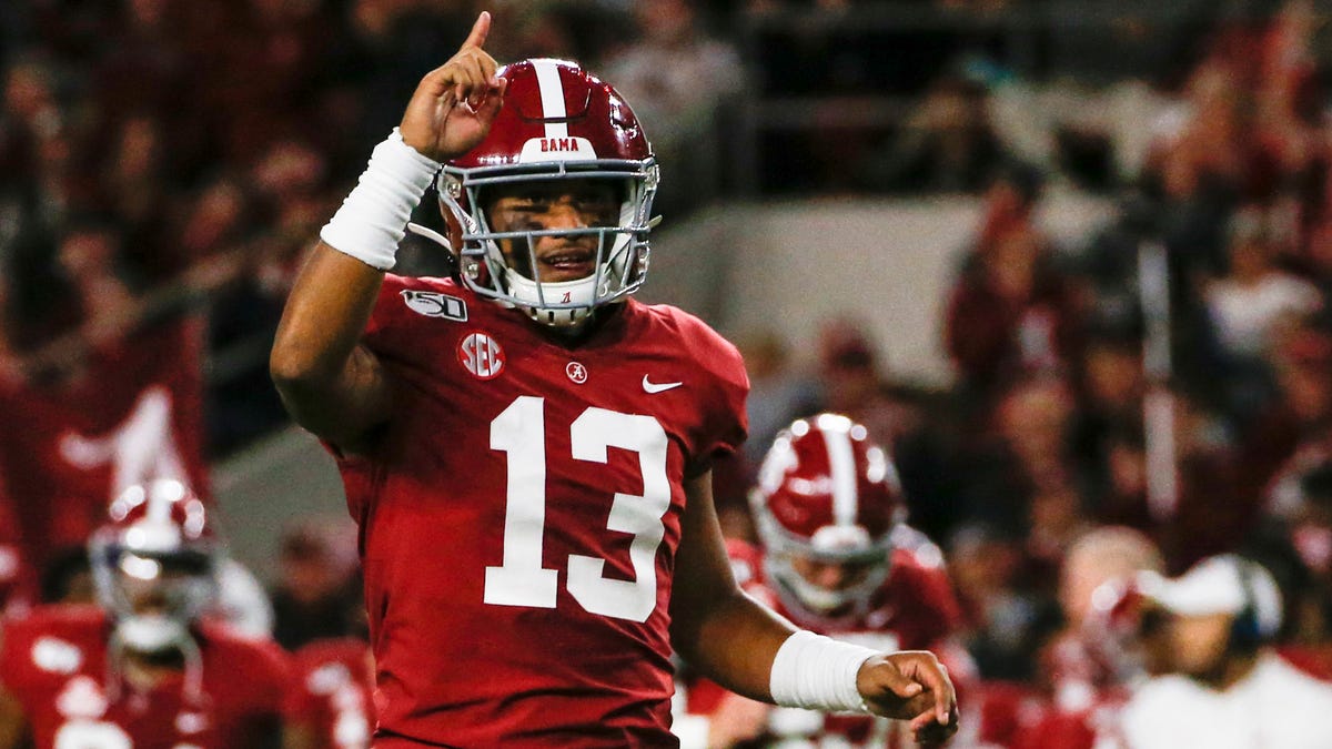 Alabama Crimson Tide quarterback Tua Tagovailoa (13) celebrates after a touchdown during the first half of an NCAA football game against the Tennessee Volunteers at Bryant-Denny Stadium.