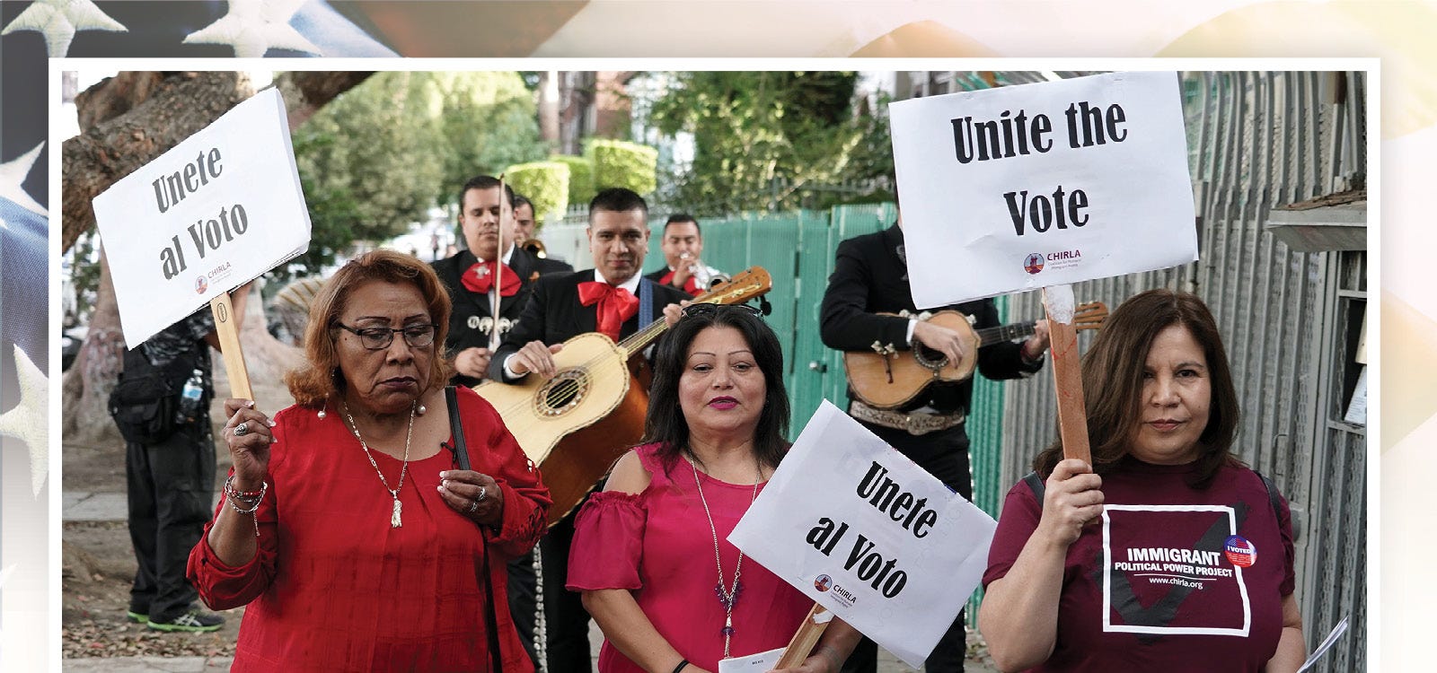 Latino voters carry signs that read "Unite the Vote" as they are serenaded by mariachis on their way to their polling station to cast their ballots in the 2018 midterm general election in Los Angeles, California, Nov. 6, 2018.