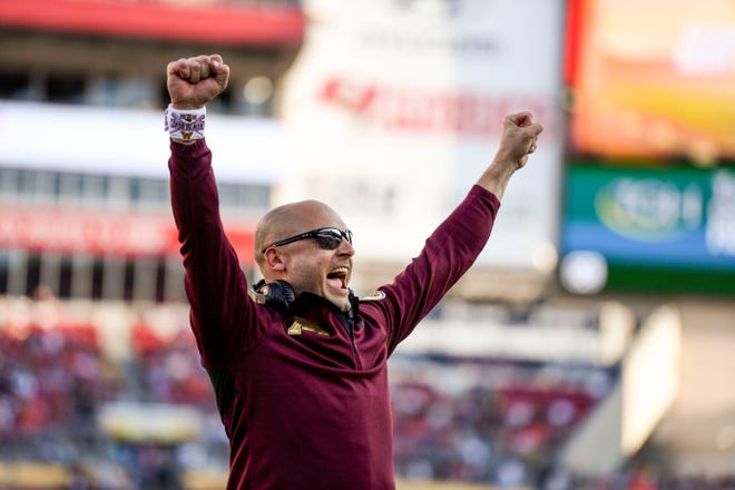 Jan 1, 2020; Tampa, Florida, USA; Minnesota Golden Gophers head coach PJ Fleck (sunglasses) reacts during the fourth quarter of the game against the Auburn Tigers at Raymond James Stadium. Mandatory Credit: Douglas DeFelice-USA TODAY Sports
