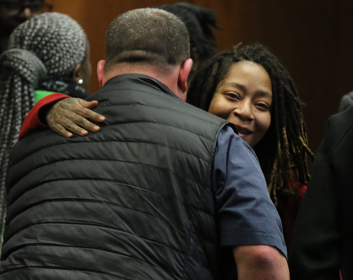 Essex County Detective Christopher Smith and assault victim Tiffany Taylor hug following the verdict in Khalil Wheeler-Weaver's trial. He was found guilty on three counts of murder, and of the rape and attempted murder of Taylor.