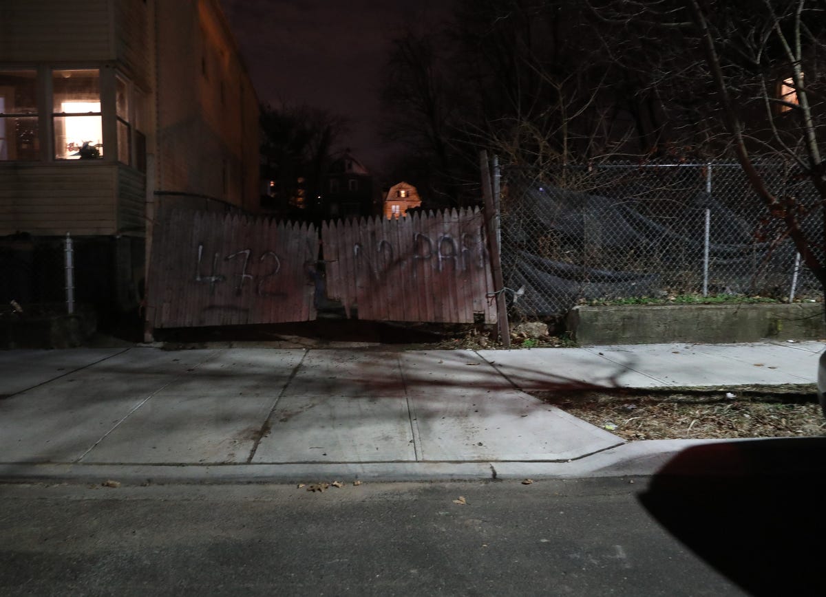 A gated, empty lot in Orange, New Jersey where an abandoned house once stood. The house, containing the body of Robin West, was burned to the ground.