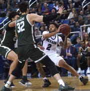 Nevada's Jalen Harris looks to pass while taking on Colorado State during their basketball game at Lawlor Events Center in Reno on Jan. 1, 2020.
