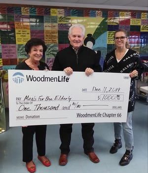Local Financial Representative Tommy Wood, center, with WoodmenLife Chapter 66 in San Angelo, presents a check for $1,000 to Meals for the Elderly President and CEO Charlyn Ocker, left, and Marketing and Event Director Dannielle Dunagan, right.