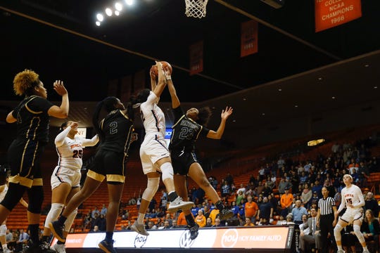 Ariona Gill fights for a rebound with Florida International's Bre'Osha Scott Thursday night at the Don Haskins Center