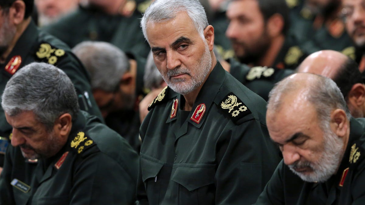 In this Sept. 18, 2016, file photo provided by an official website of the office of the Iranian supreme leader, Revolutionary Guard Gen. Qasem Soleimani, center, attends a meeting in Tehran, Iran. Iraqi TV and three Iraqi officials said Friday, Jan. 3, 2020, that Soleimani, the head of Iran's elite Quds Force, has been killed in an airstrike at Baghdad's international airport. (Office of the Iranian Supreme Leader via AP, File)