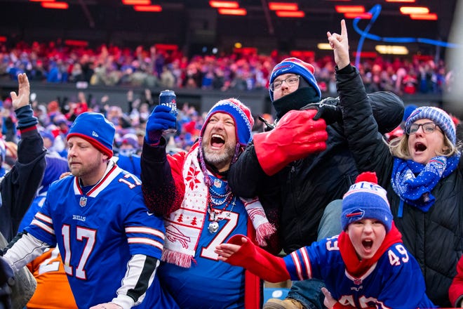 ORCHARD PARK, NY - NOVEMBER 24:  Buffalo Bills fans celebrate a review resulting in a touchdown for the Buffalo Bills during the fourth quarter against the Denver Broncos at New Era Field on November 24, 2019 in Orchard Park, New York. Buffalo defeats Denver 20-3.  (Photo by Brett Carlsen/Getty Images)