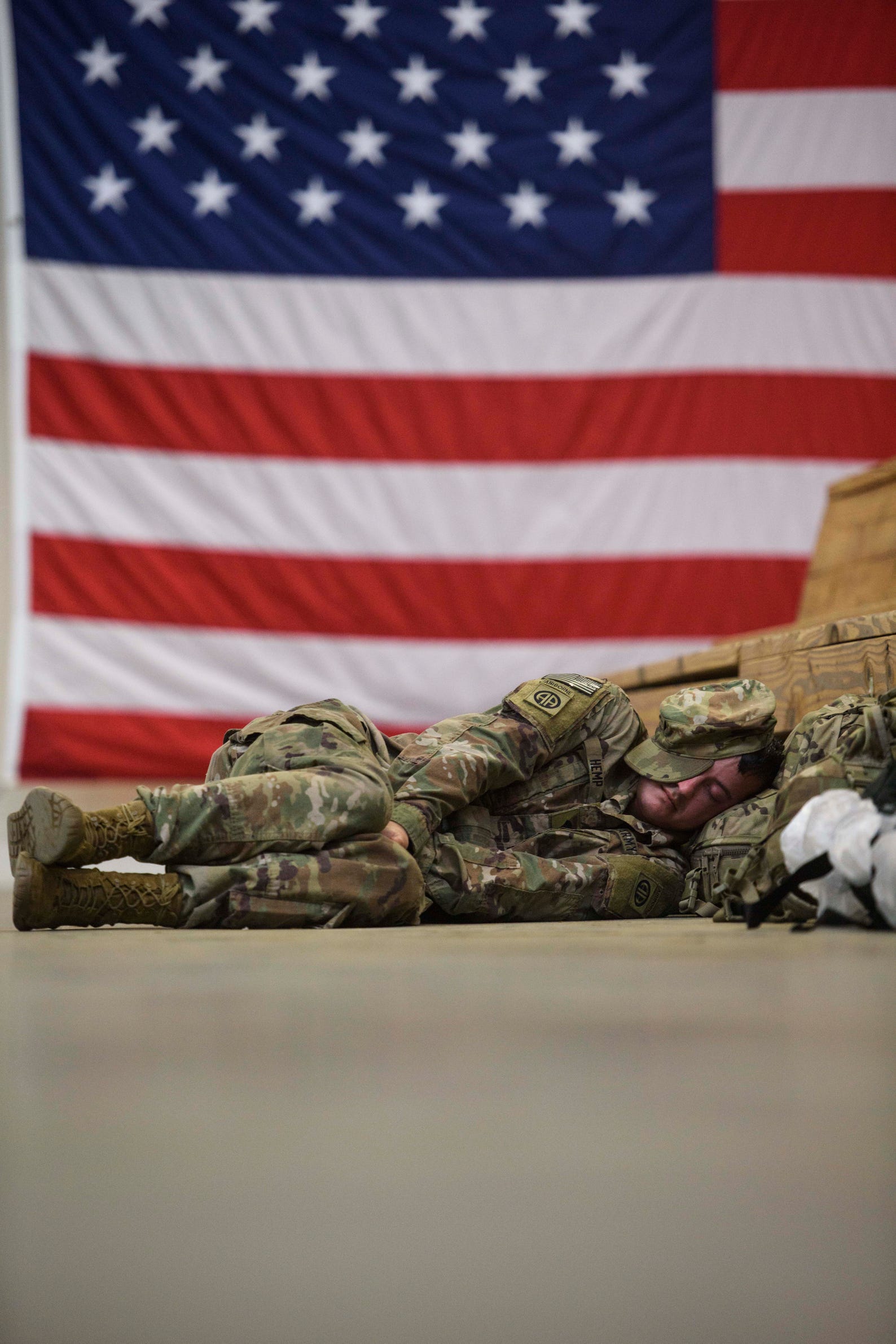 A soldier with the 82nd Airborne Division rests after having met with his unit at 4 am at Fort Bragg.