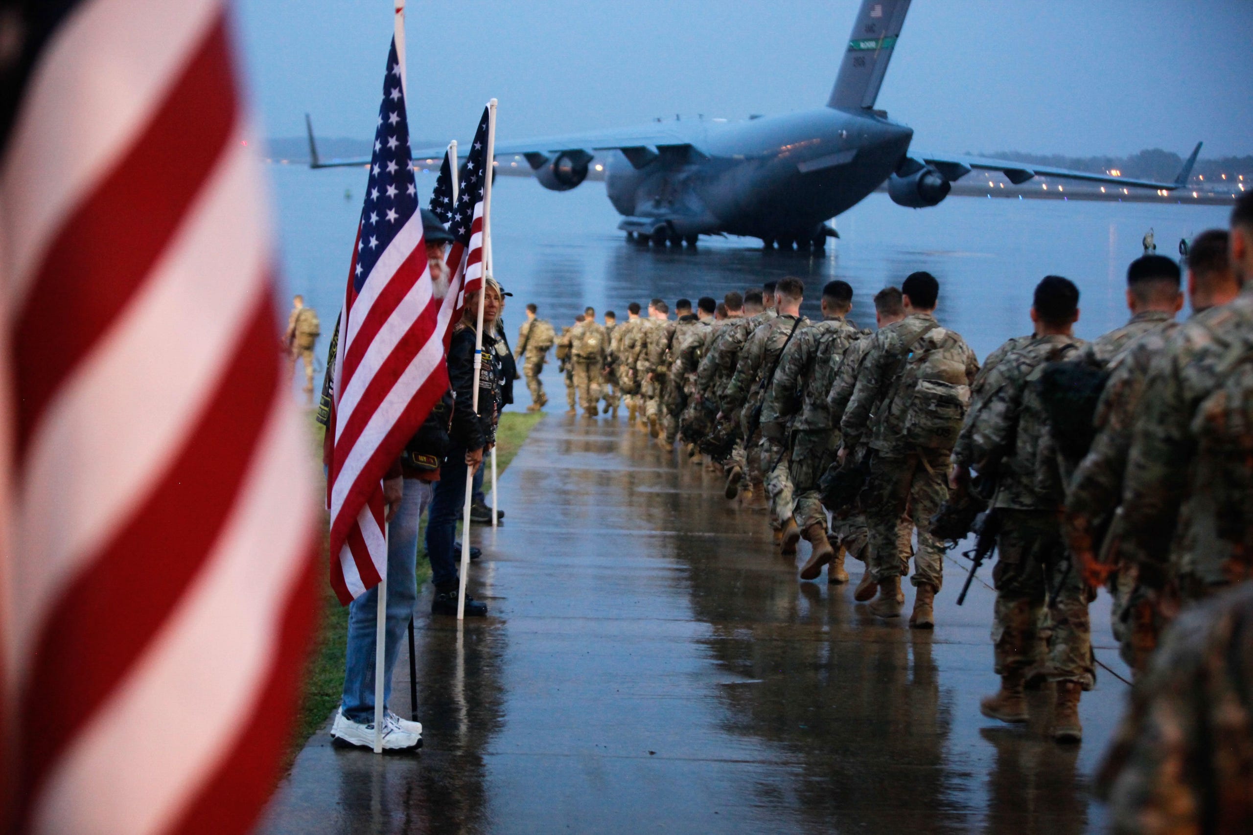 82nd Airborne paratroopers march to board a civilian aircraft bound for the US Central Command area.