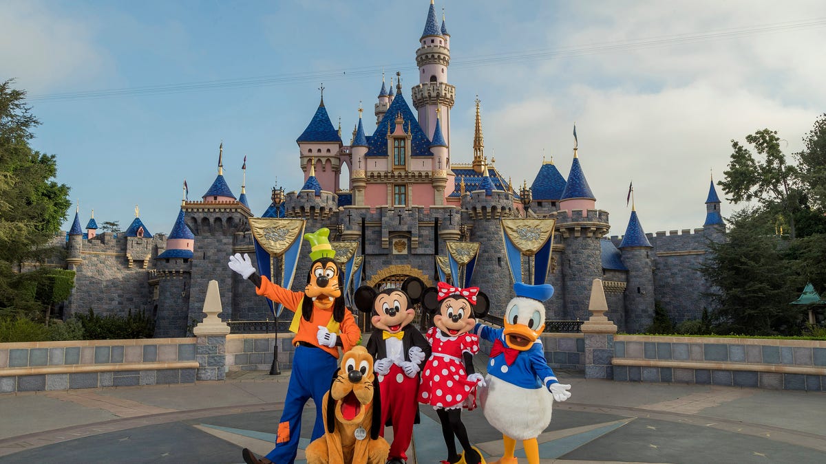 Standing in front of Sleeping Beauty Castle at Disneyland Park, Mickey Mouse, Minnie Mouse and their pals welcome visitors from all over the world.