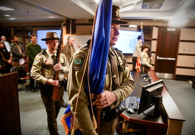 Stearn's County Sheriff's Department Honor Guard members present the colors before the start of the county board meeting Tuesday, Jan. 7, 2020, in St. Cloud. 