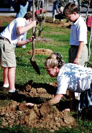 Twenty years ago, these students buried a time capsule and planted 12 trees at the (former) Academic Resource Center on Appleyard Drive.
