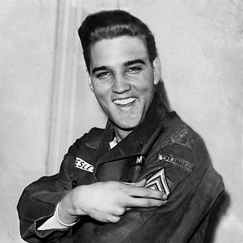 Elvis Presley smiles after he is promoted to army 
