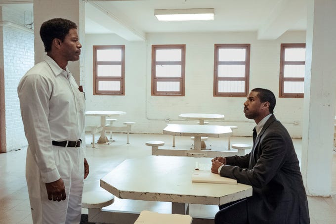 Death row inmate Walter McMillian (Jamie Foxx) meets with attorney Bryan Stevenson (Michael B. Jordan) in "Just Mercy."