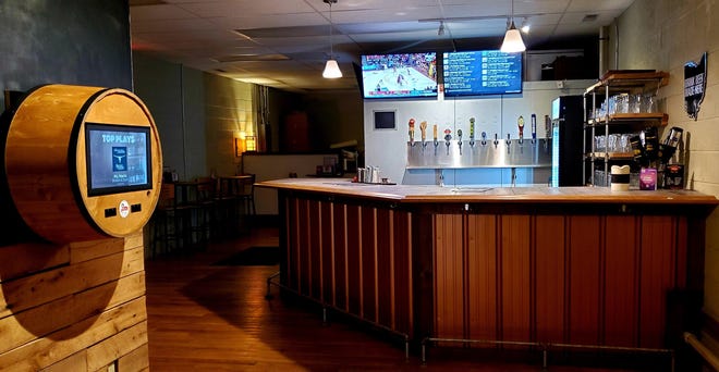 1803 Brewery & Taproom features a digital menu of draft offerings and TouchTunes for music.