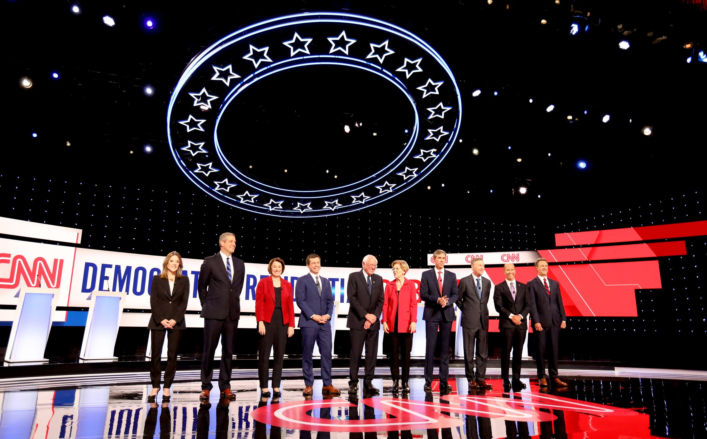 Democratic Presidential candidates line up waving to the crowd before the start of the debate at the Fox Theatre in Detroit, Michigan on Tuesday, July 30, 2019. 
(L to R) Marianne Williamson, Tim Ryan, Sen. Amy Klobuchar, Mayor of South Bend, Indiana, Pete Buttigieg, Sen. Bernie Sanders, Sen. Elizabeth Warren, Beto O'Rourke, John Hickenlooper, John Delaney and Montana Governor, Steve Bullock.