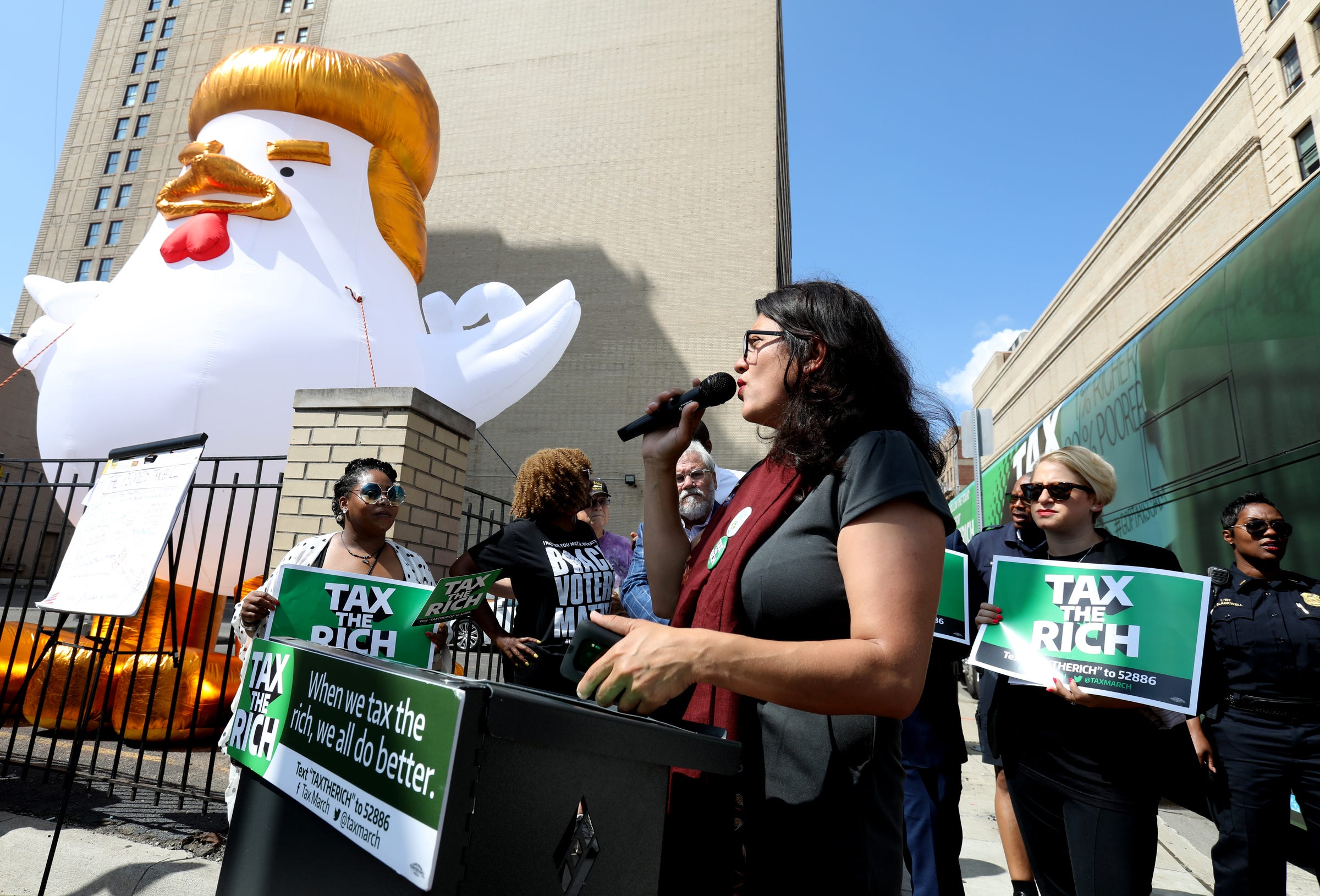 Rep Rashida Tlaib (D-MI 13th District) talks with a crowd gathered near the Fillmore and the Fox Theatre for a Tax the Rich rally hours before the Democratic Presidential debate at the Fox Theatre in Detroit, Michigan on Tuesday, July 30, 2019