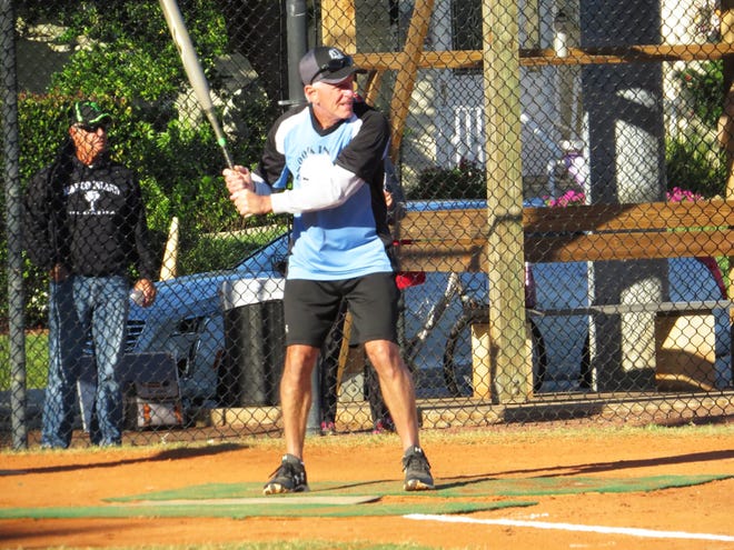 Snook Inn’s Fred Pendergrass prepares himself in the batter’s box ready to lash out one of his three hits in the game against Sand Bar.
