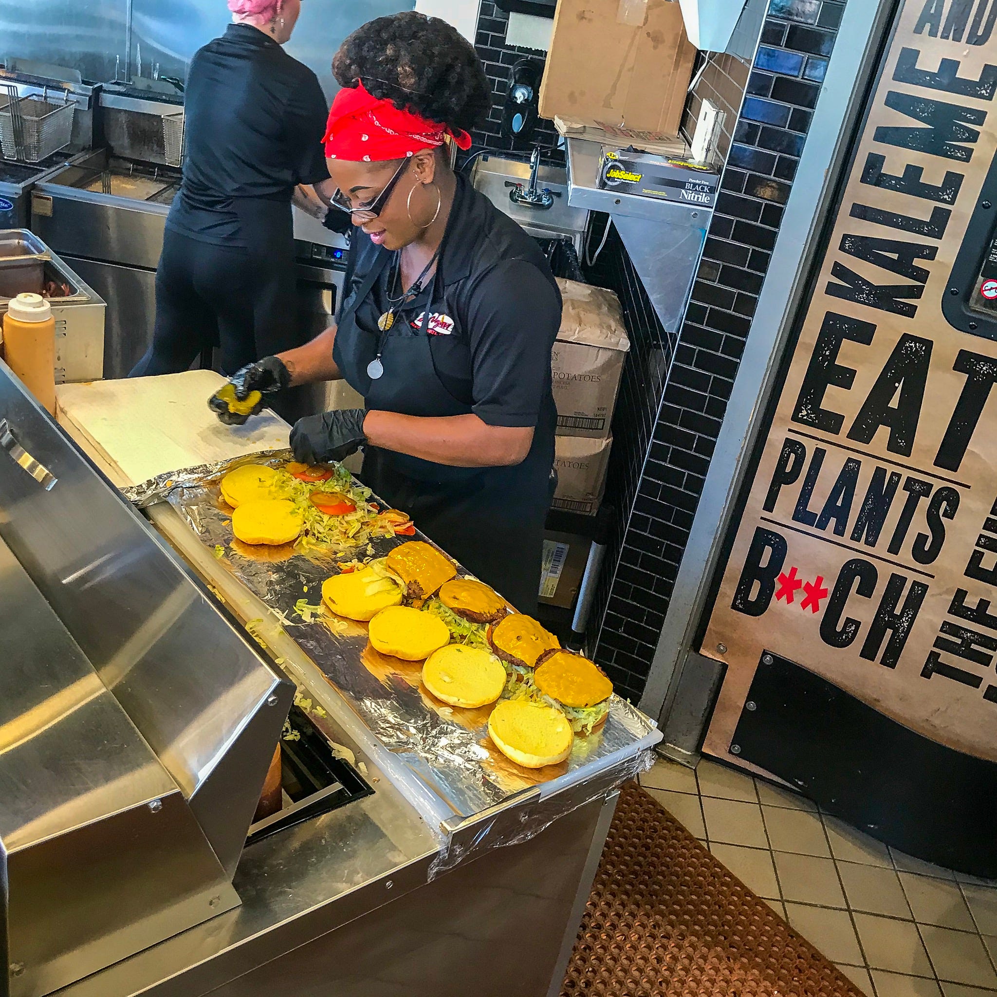 The staff at Slutty Vegan in Atlanta treats work like a party, yelling to the crowd and singing along to the music.