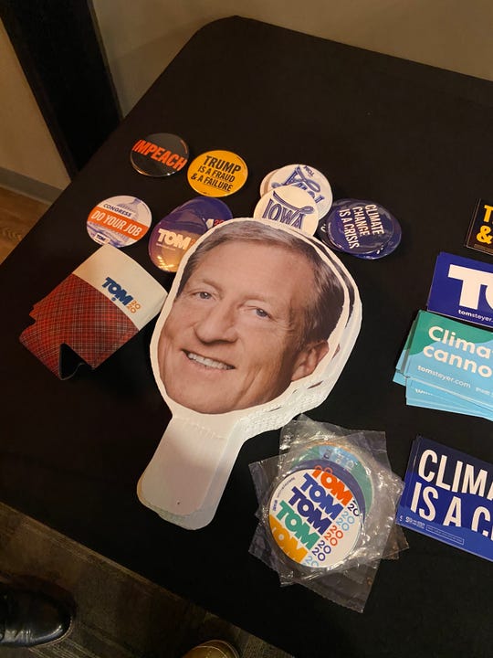 Tom Steyer, a hedge-fund billionaire running for president, puts a green-and-red plaid design on koozies he offers to potential supporters. Lesser-known candidates have been known to use "quirks" to help them stand out ahead of the Iowa Caucus.