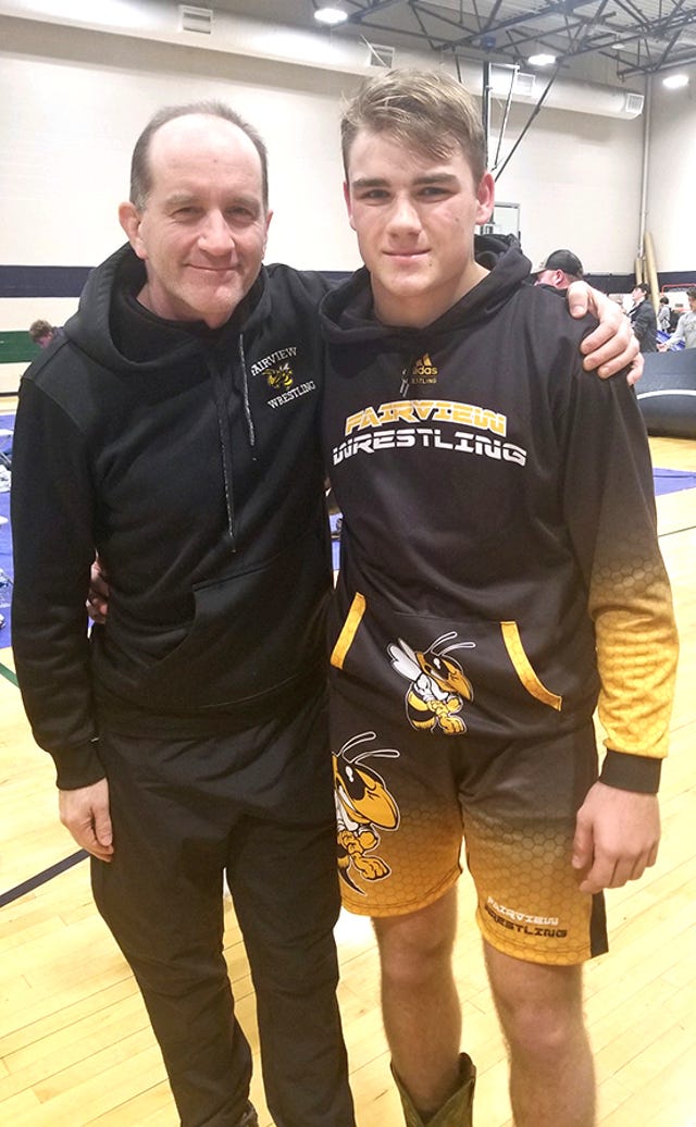 Jacob Clevenger with Coach Darryl Casey after his 8th place finish at Father Ryan on Jan. 4, 2020.