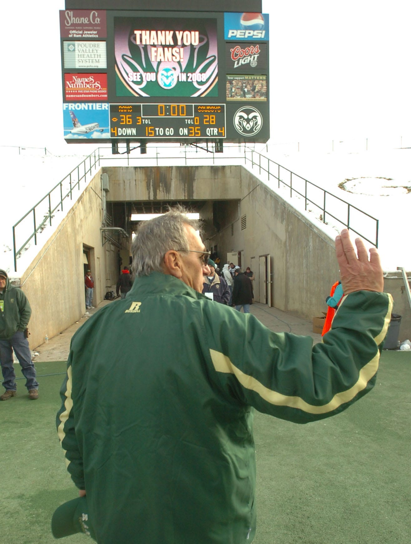 Sonny Lubick waves to fans as he leaves the field after a win against Wyoming in 2007. Three days later, CSU announced his firing.