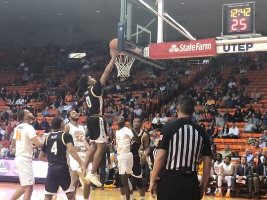 Southern Miss' Gabe Watson drives to the basket against the UTEP defense Thursday night at the Don Haskins Center
