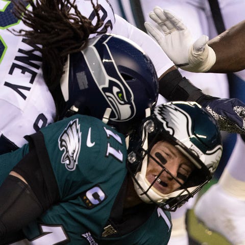 Eagles quarterback Carson Wentz is hit by Seattle 
