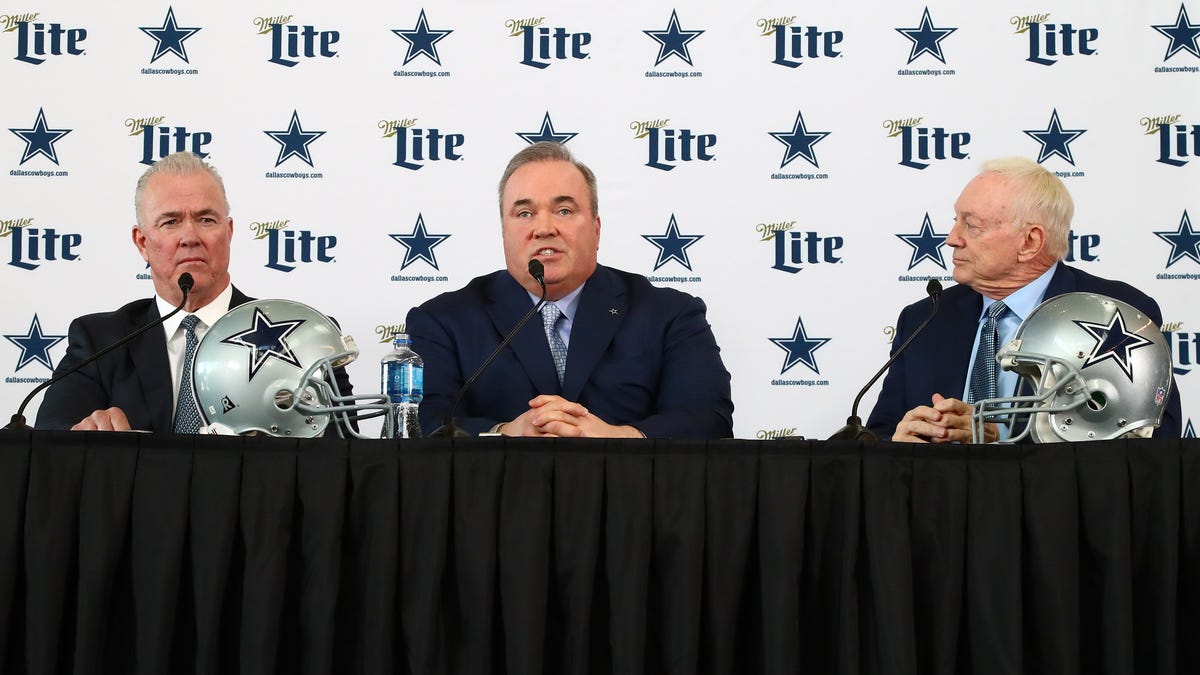 Mike McCarthy answers questions as he is flanked by owner Jerry Jones (right) and executive vice president Stephen Jones during a press conference at Ford Center at the Star.