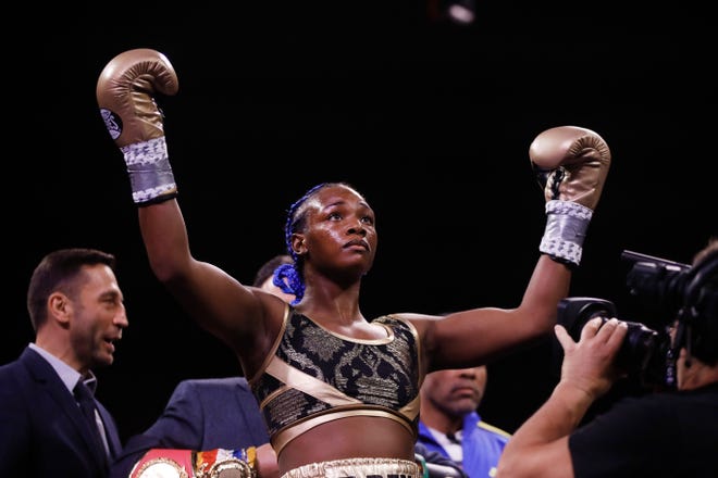 Claressa Shields stands for her introduction for a fight with Ivana Habazin in a women's 154-pound title boxing bout in Atlantic City, N.J., Friday, Jan. 10, 2020.