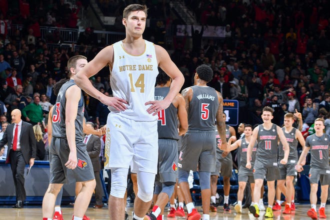 Jan 11, 2020; South Bend, Indiana, USA; Notre Dame Fighting Irish forward Nate Laszewski (14) reacts as time expires in the second half against the Louisville Cardinals at the Purcell Pavilion. Mandatory Credit: Matt Cashore-USA TODAY Sports