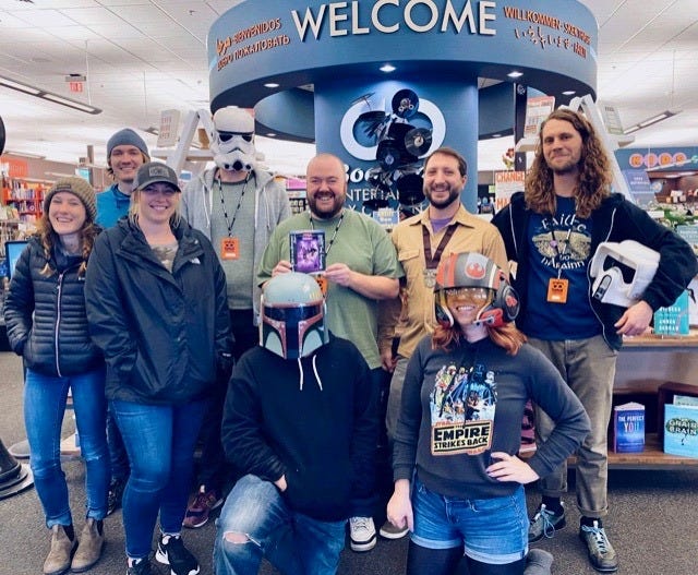Bookmans Flagstaff staff with their "Star Wars" DVD signed by Mark Hamill.