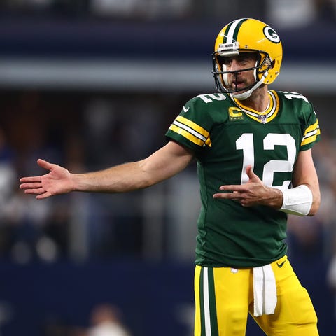 Green Bay Packers quarterback Aaron Rodgers (12) r