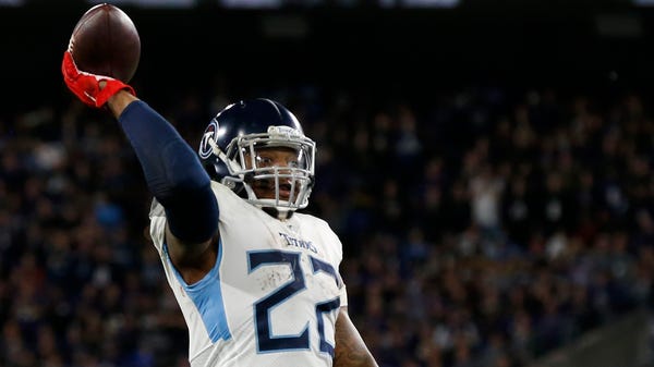 Tennessee Titans running back Derrick Henry throws