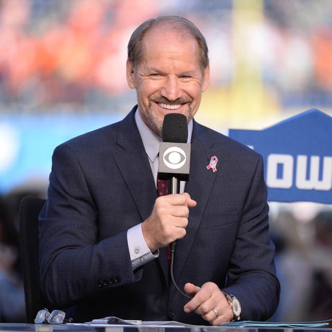 Analyst Bill Cowher gestures before the game betwe
