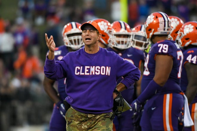 Clemson coach Dabo Swinney walks on the sideline during his team's game against Wofford in 2019 at Clemson Memorial Stadium.