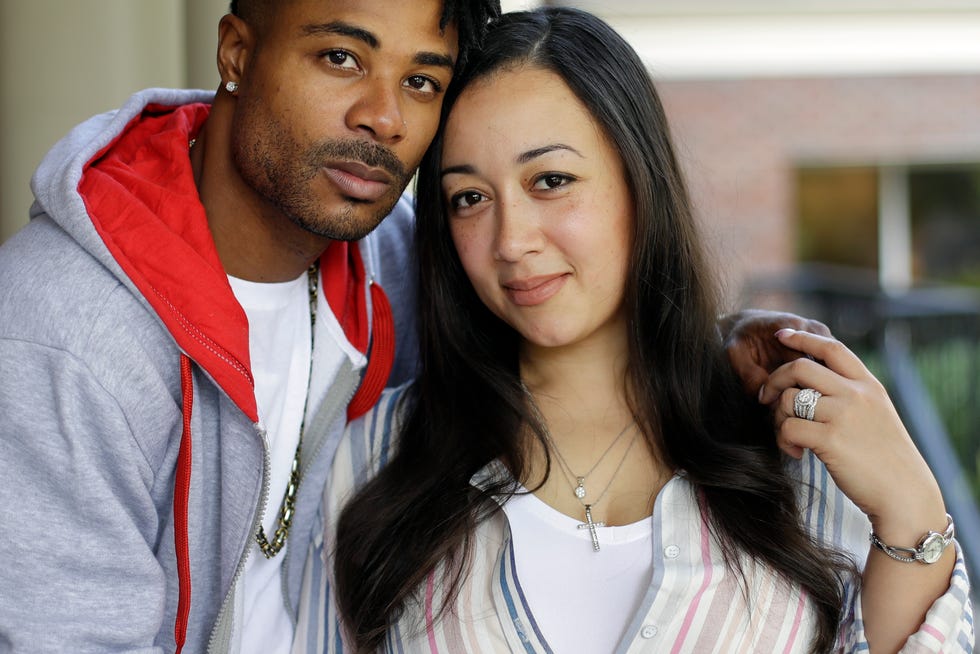 In this Sept. 20, 2019, photo, Cyntoia Brown-Long and her husband, Jamie Long, pose together in Nashville, Tenn. For nearly half of her life, Brown-Long was locked up. At 16, she was arrested for robbing and killing a man she says picked her up for sex and later sentenced to life in prison. But last fall Brown-Long, 31, walked out of a Tennessee prison after successfully petitioning the Tennessee governor for her clemency. She's now speaking for herself in her memoir, "Free Cyntoia: My Search for Redemption in the American Prison System," released on Oct. 15.