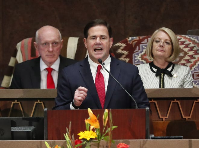 Gov. Doug Ducey delivers his State of the State address with House Speaker Rusty Bowers and Senate President Karen Fann behind him at the Arizona Capitol on Jan. 13, 2020.