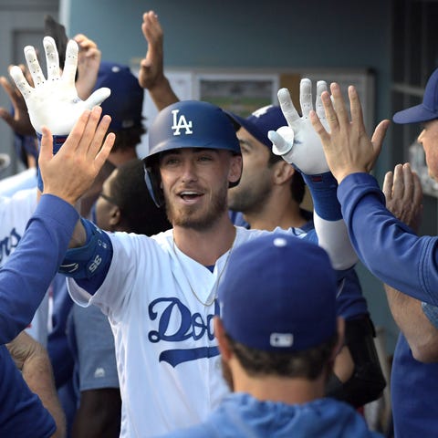 Cody Bellinger celebrates with teammates after hit