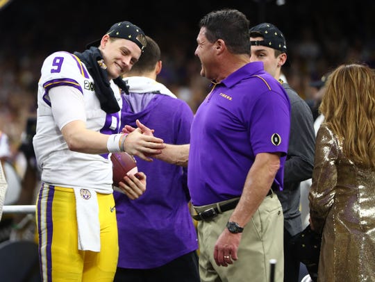 Jan 13, 2020; New Orleans, Louisiana, USA; LSU Tigers head coach Ed Orgeron celebrates with quarterback Joe Burrow (9) after defeating the Clemson Tigers in the College Football Playoff national championship game at Mercedes-Benz Superdome. Mandatory Credit: Mark J. Rebilas-USA TODAY Sports