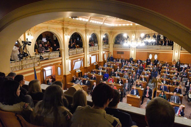 A full room of legislators and and citizens listen as Governor Kristi Noem gives the annual State of the State address on Tuesday, Jan. 14, in the House Chamber at the State Capitol in Pierre.